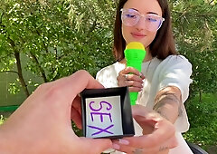 Playful cute brunette plays money or a gift with a stranger and gives him a good fuck outdoor