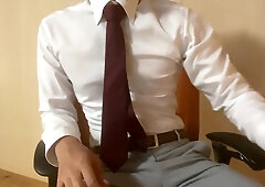 Asian boy drains while dressed in a suit (four)