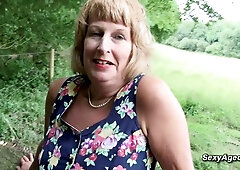 Grannie plays with her gash outdoor