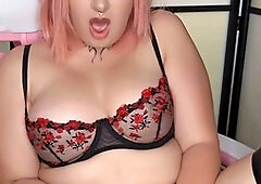 Pink-haired anime cosplay character indulging in some solo play