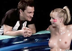 2 hot blondes get all oiled up and banged hard in an inflatable pool.
