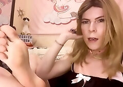 Jessica Bloom engages in foot worship and licking with a dominant trans twist