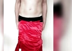 Sissy in red nylons cums out of touching clitty