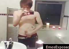Emo stud jerking his penis in the mirror