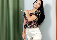 Cute brunette with tattoos fucks herself with a dildo