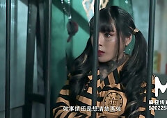 Ai Qiu plays a submissive prisoner in a naval interrogation scene with spanking and gagging