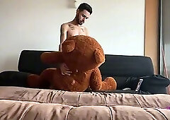 Skinny, big-cocked twink jerking off with his teddy bear while playing video games.