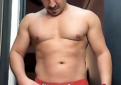 Latin hunk tries on undies and shows his cock