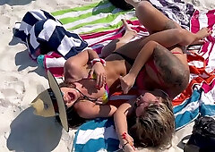 Jenna Noelle shares steamy moments with another woman on the beach and in the jacuzzi